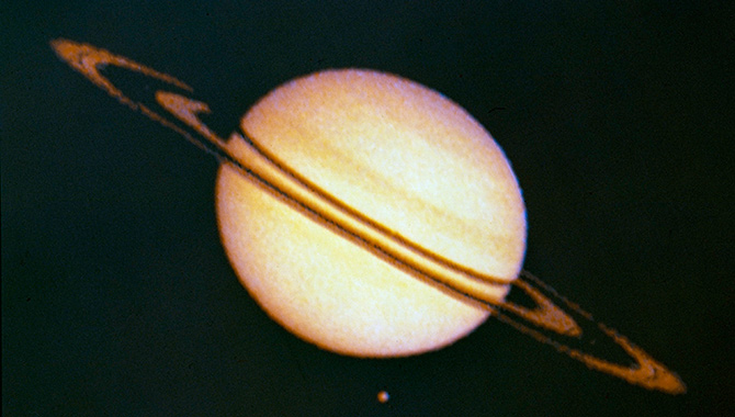 Saturn and its largest moon, Titan, seen from Pioneer 11. Photo Credit: NASA/Ames Research Center