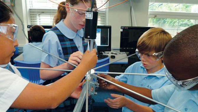 Students from the St. Thomas More Cathedral School work on the antenna that will enable the school to communicate with their satellite, the St. Thomas More Satellite (STMSat)-1. STMSat-1 was designed, built, and tested by elementary school students, and was launched to the ISS as part of NASA’s ELaNa IX program. Image courtesy of STM.