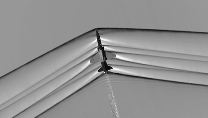 Created using a technique known as “schlieren,” this image shows the shock wave formed by a USAF T-38C aircraft flying at supersonic speed. Data from schlieren images will help NASA design quieter supersonic aircraft. Photo Credit: NASA