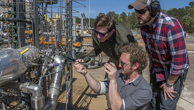 One of the engineering challenges facing NASA in the 21st century is the need to design and build effective but affordable technologies that will support missions to Mars. Here, engineers get ready to test a 3-D printed rocket engine turbopump using liquid methane at Marshall Space Flight Center. An engine with this technology could power a Mars lander. Photo Credit: NASA/MSFC/Emmett Given