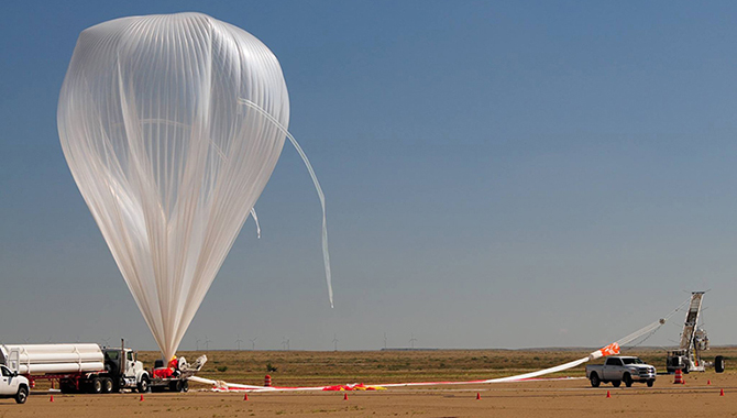 The HOPE team readied the RaD-X High Altitude Science Balloon in preparation for the launch at Fort Sumner, NM, on September 25, 2015. The project remained in flight for 24 hours as it collected data from two regions in the stratosphere. Photo Credit: NASA/JPL-Caltech