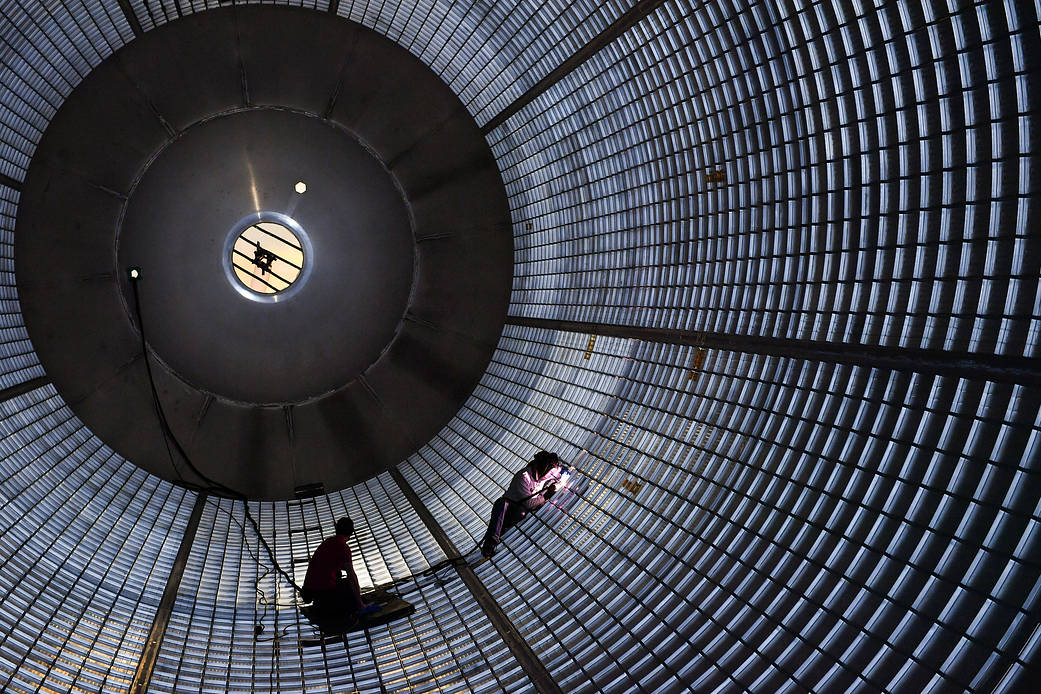 NASA is developing the world’s most powerful launch vehicle, the Space Launch System (SLS), to enable crewed missions to deep space. In this image, welders plug holes in a large liquid hydrogen tank for the SLS, using a technique that produces high-strength bonds that are essentially free of defects. Credit: NASA/Michoud/Steve Seipel
