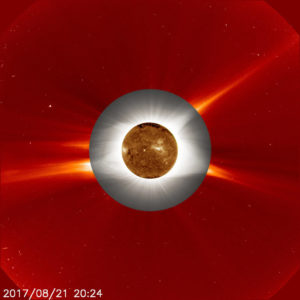 This compilation of images includes a ground-based image of the lower corona taken during the total solar eclipse (gray middle ring) superimposed over a space-based image of the corona (red outermost ring), as seen by the ESA/NASA Solar and Heliospheric Observatory (SOHO). At the center is an image of the sun’s surface taken by NASA’s Solar Dynamics Observatory in extreme ultraviolet wavelengths of light. Credits: Innermost image: NASA/SDO Ground-based eclipse image: Jay Pasachoff, Ron Dantowitz, Christian Lockwood, and the Williams College Eclipse Expedition/NSF/National Geographic Outer image: ESA/NASA/SOHO