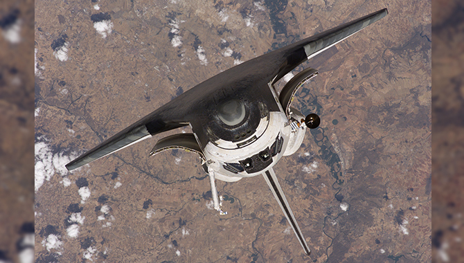 The Space Shuttle Discovery approaches the International Space Station for docking but before the link-up occurred, the orbiter "posed" for a thorough series of inspection photos. Photo Credit: NASA