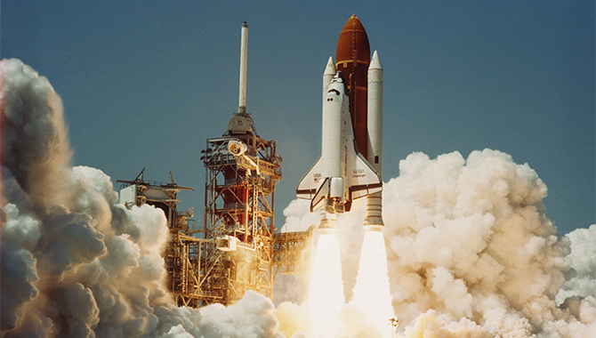 The maiden launch of space shuttle Challenger, which carried the first TDRS satellite to orbit. Photo Credit: NASA
