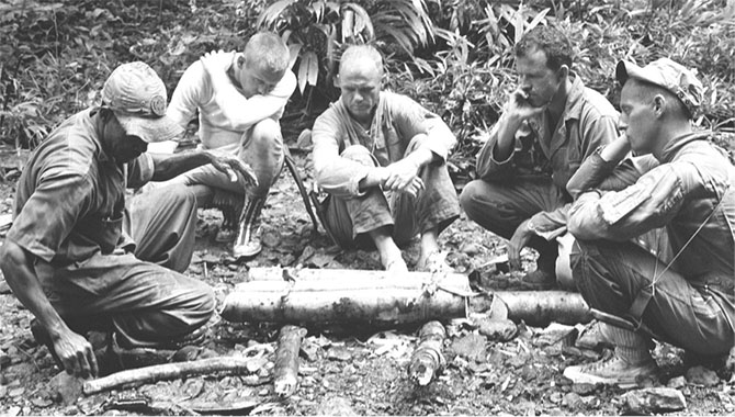 Astronauts participate in tropical survival training at Albrook Air Force Base near the Panama Canal. From left to right are an unidentified trainer, Neil Armstrong, John H. Glenn, Jr., L. Gordon Cooper, and Pete Conrad. Survival training was, and still is, an important exercise for astronauts, as a launch abort or misguided reentry could potentially land them in a remote wilderness area. Photo Credit: NASA