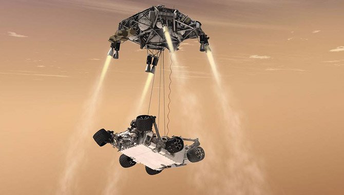 This artist's concept shows the sky crane maneuver during the descent of NASA's Curiosity rover to the Martian surface. Image Credit NASA