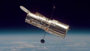 The Hubble Space Telescope (HST) seen from the Space Shuttle Discovery. Credit: NASA