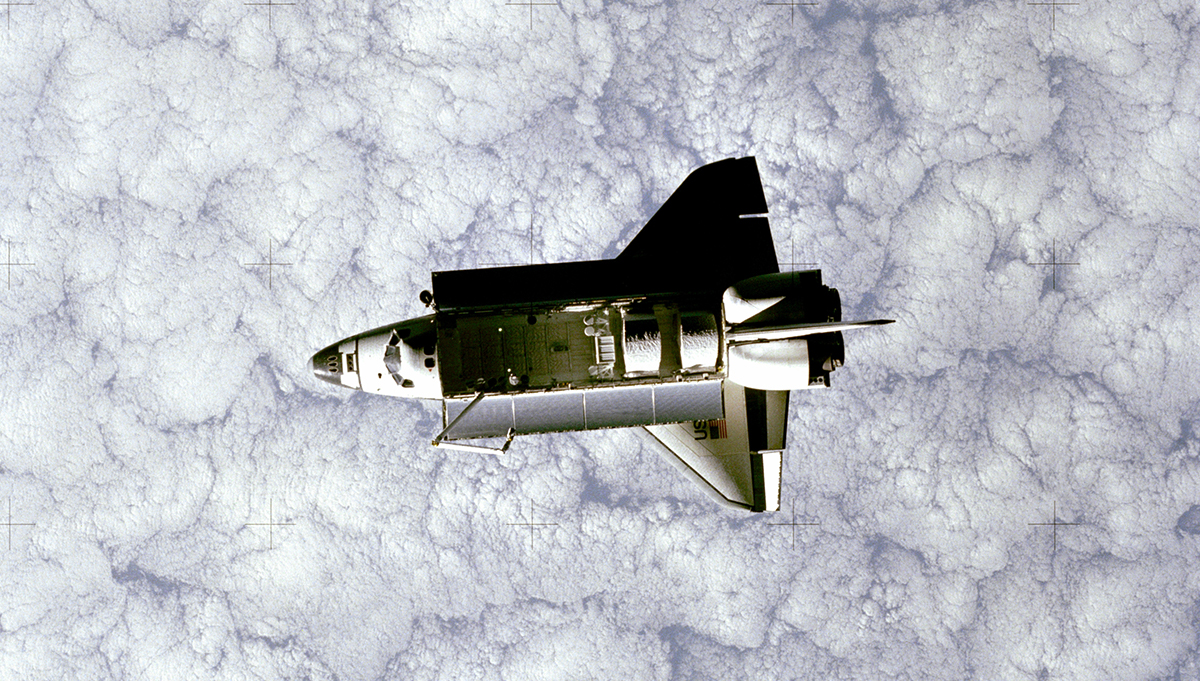 Space Shuttle Challenger, orbiting the Earth, as seen from a camera mounted on the first Shuttle Pallet Satellite. Credit: NASA
