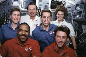 Wearing red shirts are Payload Commander and Mission Specialist Bernard Harris Jr. and Mission Specialist Michael Foale. Wearing blue shirts are Mission Specialist Janice Voss and Commander James Wetherbee. Wearing white shirts are Mission Specialist Vladimir Titov and Pilot Collins. Credit: NASA
