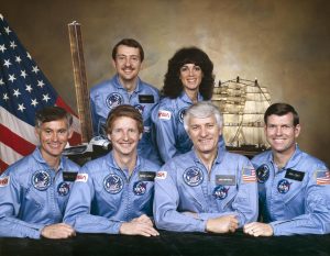 The crew assigned to the STS-41D mission included (seated left to right) Richard M. (Mike) Mullane, mission specialist; Steven A. Hawley, mission specialist; Henry W. Hartsfield, commander; and Michael L. (Mike) Coats, pilot. Standing in the rear are Charles D. Walker, payload specialist; and Judith A. (Judy) Resnik, mission specialist. Credit: NASA