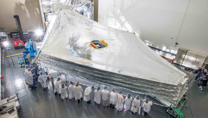 The sunshield on NASA's James Webb Space Telescope, shown here stacked and expanded in a cleanroom in the Northrop Grumman facility in Redondo Beach, California, will be folded up during launch and deploy in space. Credit: NASA