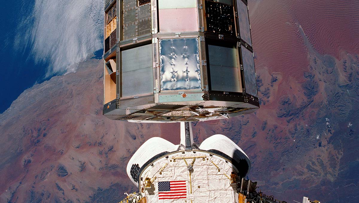 The Long Duration Exposure Facility (LDEF), after nearly six years orbiting Earth, is retrieved during space shuttle mission STS-32. LDEF gathered data about how high-performance spacecraft materials withstand long-term exposure to solar radiation, space debris, and the extreme temperatures of Low Earth Orbit. This information helped engineers select the best materials to build the International Space Station, Mars rovers, and other spacecraft. Credit: NASA
