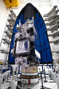 The first half of the United Launch Alliance Atlas V payload fairing is being secured around NOAA’s Geostationary Operational Environmental Satellite-T (GOES-T) inside the Astrotech Space Operations facility in Titusville, Florida, on Feb. 7, 2022. Credit: NASA/Ben Smegelsky