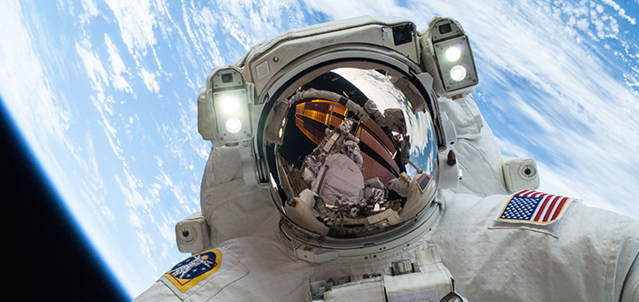 Astronaut during a space walk with the Earth in the background.