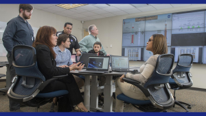 Group of people in an office having a discussion.