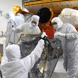 In a clean room inside the Astrotech Payload Processing Facility at Vandenberg Air Force Base in California, Ball Aerospace technicians conduct a final cleaning and inspection of the Cross-track Infrared Sounder (CrIS) on NASA’s National Polar-orbiting Operational Environmental Satellite System Preparatory Project (NPP) spacecraft. Credit: NASA_VAFB