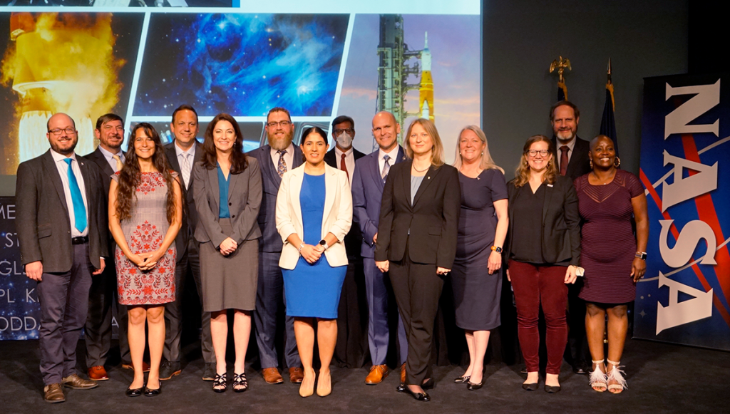 Systems Engineering Leadership Program (SELP) graduates posing for a photo. Left to right front row: Evan Anzalone, Sarah N. D'Souza, Carla Haroz, Claudia Eyzaguirre, Susan Danley, Karma Snyder, Laura Kushner, K. Renee Horton. Back row: Ben Powell, Darren Baird, Miles Skow, Timothy Roberts, Andrew Rechenberg, George J. Williams, Jr. <br />Credit: NASA/Masha Berger