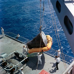 The Gemini-4 spacecraft is hoisted aboard the recovery ship USS Wasp during recovery operations following the successful four-day mission. Credit: NASA