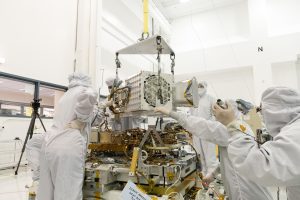 Engineers and technicians at NASA's Jet Propulsion Laboratory in Southern California assemble components of the EMIT mission instrument in December 2021. Credits: NASA/JPL-Caltech