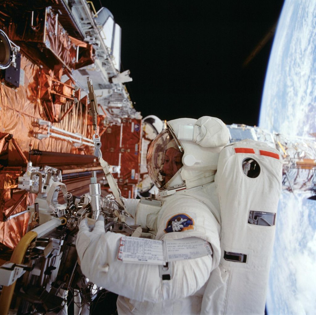 Astronaut Kathryn C. Thornton works with equipment associated with servicing chores on the Hubble Space Telescope (HST) during the fourth extravehicular activity (EVA) on the eleven-day mission. Credit: NASA