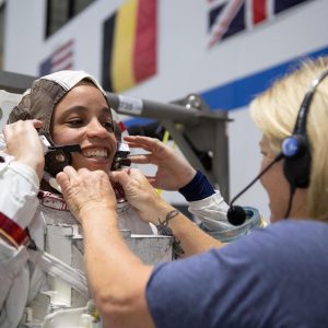 2017 NASA astronaut candidate Jessica Watkins is helped into a spacesuit prior to underwater spacewalk training at NASA Johnson Space Center’s Neutral Buoyancy Laboratory in Houston. Credit: NASA/David DeHoyos