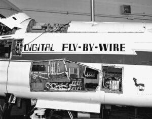 NASA tested Digital Fly-By-Wire technology by fitting the electronic flight-control system and computers into a heavily modified F-8 Crusader single-engine, supersonic fighter jet. The computer is partially visible in the avionics bay at the top of the fuselage. Between 1972 and 1985, NASA conducted 211 test flights. Credit: NASA