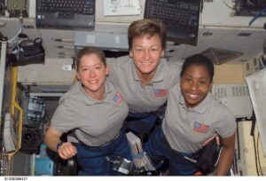 Astronauts Pam Melroy (left), STS-120 commander; Peggy Whitson, Expedition 16 commander; and Stephanie Wilson, STS-120 mission specialist, pose for a photo in the Zvezda Service Module of the International Space Station while Space Shuttle Discovery is docked with the station. Credit: NASA