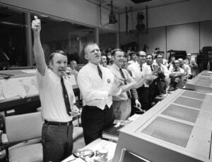 Flight Directors (left to right) Gerry Griffin, Gene Kranz, Glynn Lunney, and Milt Windler cheering after the successful splashdown of Apollo 13. Credit: NASA