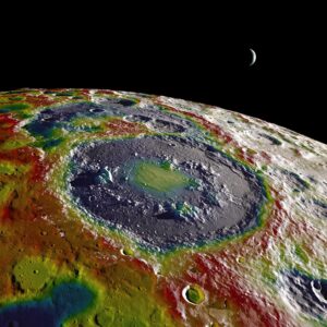 A high-resolution free-air gravity map based on GRAIL data, overlaid on terrain based on LRO altimeter (LOLA) and camera (LROC) data. The view is south-up, with the south pole near the horizon in the upper left and the crescent Earth in the distance. The terminator crosses the eastern rim of the Schrödinger basin. Gravity is painted onto the areas that are in or near the night side. Red corresponds to mass excesses and blue to mass deficits. Credit: NASA