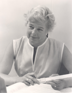 Virginia Norwood, the mother of Landsat, in 1963 with slide rule. Norwood’s father gave her her first slide rule at age 9, by the late 1960s she was designing the groundbreaking Multispectral Scanner System (MSS) for the first Landsat satellite. Photo Credit: Hughes; used with permission of Virginia Norwood.