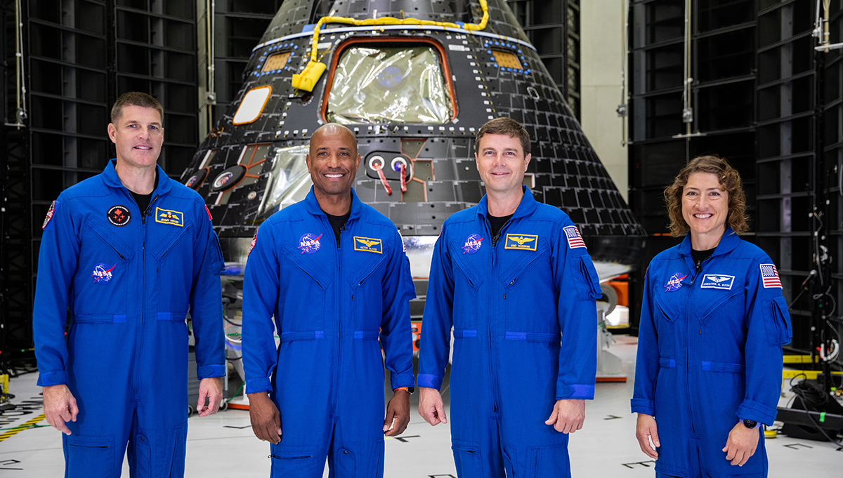 The Artemis II crew views the Orion crew module for their mission inside the Neil Armstrong Operations and Checkout Building at NASA’s Kennedy Space Center. From left, Jeremy Hansen, mission specialist; Victor Glover, pilot; Reid Wiseman, commander; and Christina Hammock Koch, mission specialist. Photo Credit: NASA/Kim Shiflett
