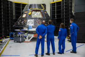 Artemis II crew members, shown inside the Neil Armstrong Operations and Checkout Building at NASA’s Kennedy Space Center in Florida, check out their Orion crew module on Aug. 8, 2023. From left are: Victor Glover, pilot; Reid Wiseman, commander; Christina Hammock Koch, mission specialist; and Jeremy Hansen, mission specialist. Photo Credit: NASA/Kim Shiflett