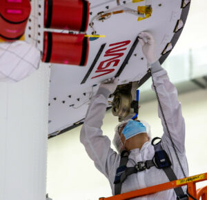 NASA’s iconic “worm” logo and European Space Agency (ESA) logo have been added to the aft wall of Orion’s crew module adapter on September 20, 2020, ahead of NASA’s Artemis I mission. Photo Credit: NASA