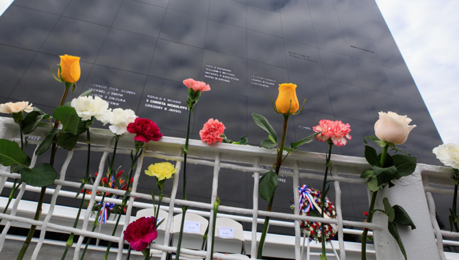 Kennedy Space Center workers and guests placed flowers at the Space Mirror Memorial at the Kennedy Space Center Visitor Complex in Florida during NASA’s Day of Remembrance on Jan. 26, 2023. Photo Credit: NASA/Kim Shiflett