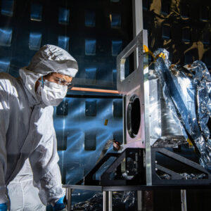 Aerospace Engineer, Daniel Senai, inspects the completed Ocean Color Instrument Solar Calibration Assembly (SCA) Life Test Unit mechanism. Credit: Henry, Dennis (Denny)