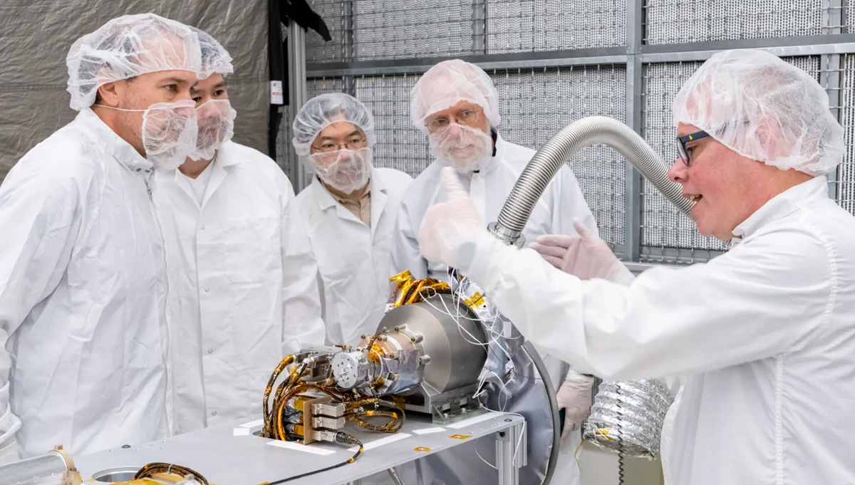 U.S. and Japanese team members gather around and discuss the gamma-ray spectrometer portion of the MEGANE instrument during its development at Johns Hopkins APL. Photo Credit: NASA/JAXA/Johns Hopkins APL/Ed Whitman