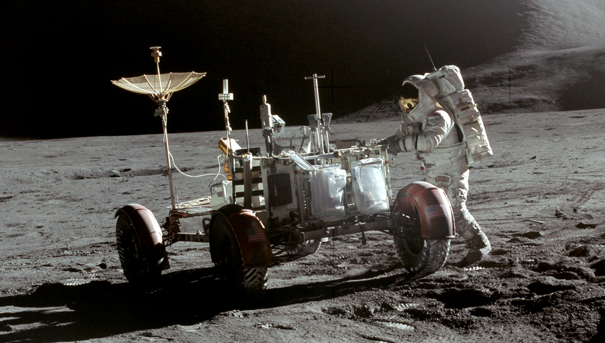 Apollo 15 Commander David Scott took this image of Lunar Module Pilot Jim Irwin beside the Lunar Roving Vehicle at the end of the mission’s first EVA. The LRV dramatically expanded the ground astronauts could cover during the final three Apollo missions. Photo Credit: NASA