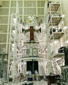 This photograph taken in 1986 shows the Hubble Space Telescope (HST) flight article assembly with multilayer insulation, high gain anterna, and solar arrays in a clean room of the Lockheed Missile and Space Company. Photo Credit: NASA