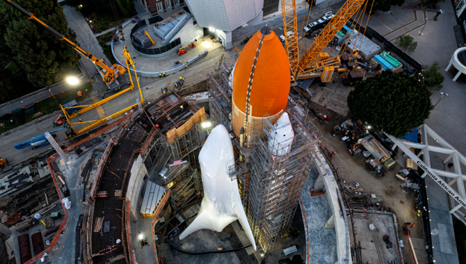 The Space Shuttle Endeavour, now in launch configuration, is covered by a protective wrap as construction continues on the new Samuel Oschin Air and Space Center, at the California Science Center in Los Angeles. Photo Credit: California Science Center