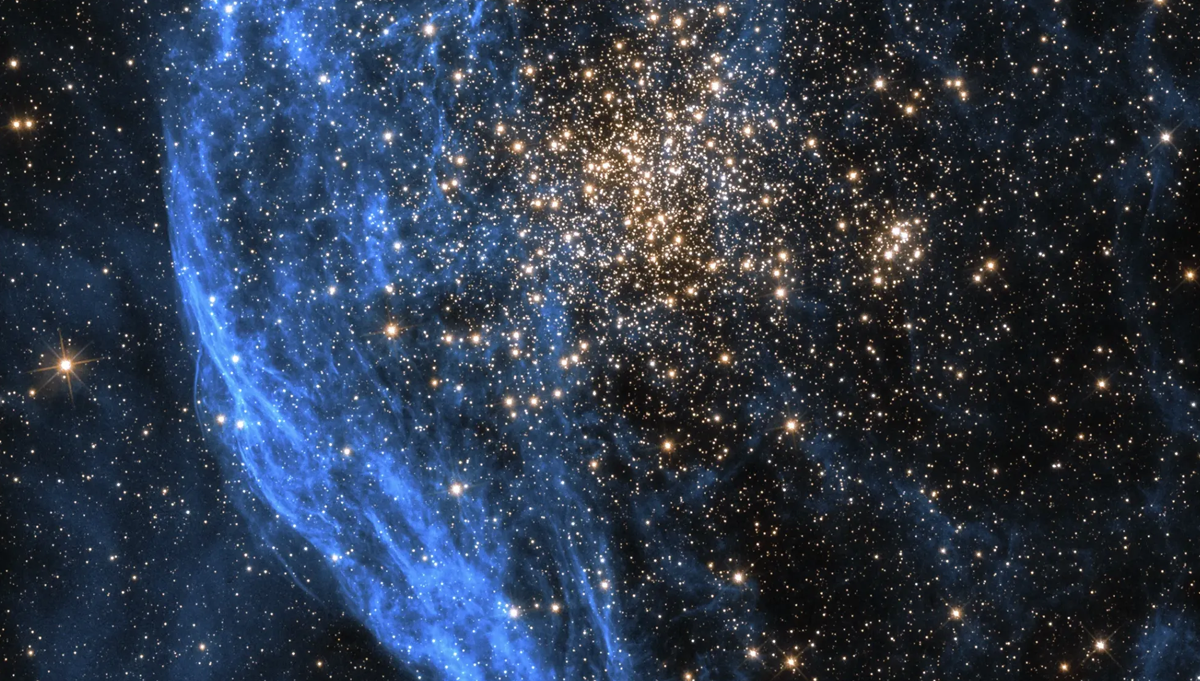 This Hubble image shows the star cluster NGC 1850, located about 160,000 light-years away. For this image, two filters were used with the camera to gather data, one at visible wavelengths the other at near-infrared wavelengths. Following chromatic order, the shorter wavelength visible light data is blue, while the longer near-infrared data is red. Credit: NASA, ESA and P. Goudfrooij