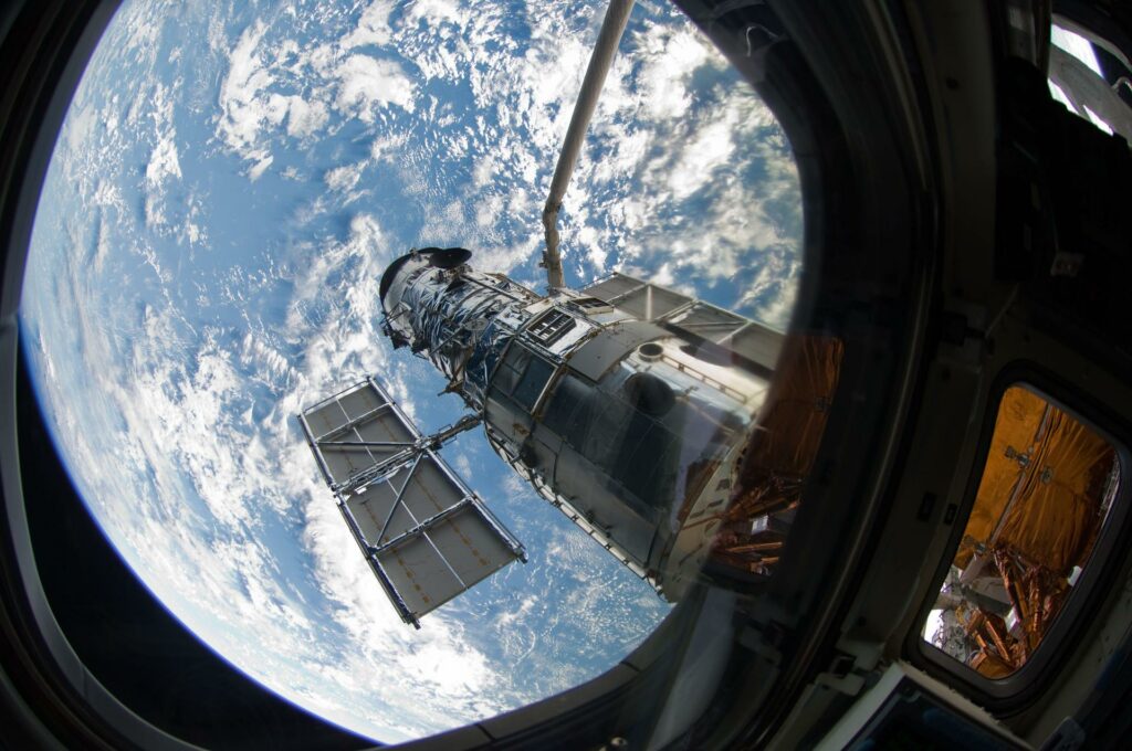 An STS-125 crew member onboard the Space Shuttle Atlantis snapped a still photo of the Hubble Space Telescope following grapple of the giant observatory by the shuttle's Canadian-built remote manipulator system. Photo Credit: NASA