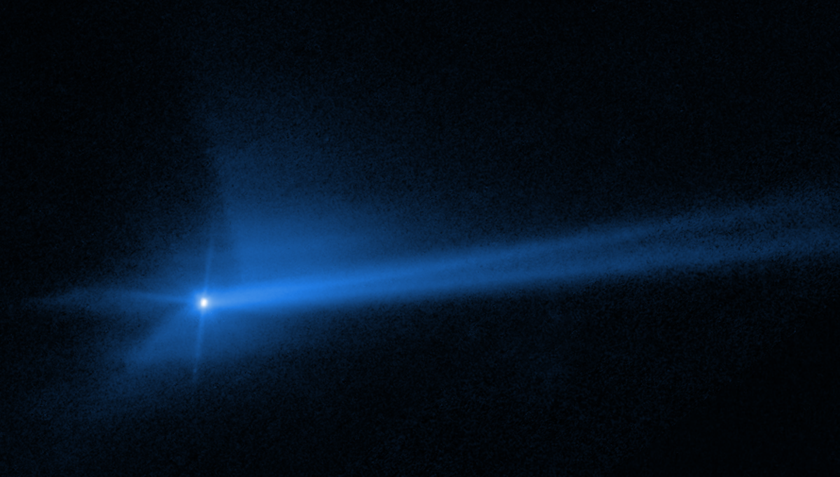 This image, captured by the Hubble Space Telescope, shows the aftermath of DART’s collision with the asteroid Dimorphos at 13,000 miles per hour, blasting more than 2 million pounds of dust and rock off the asteroid, and changing its orbit. Credit: NASA, ESA, STScI, and Jian-Yang Li (PSI); Image Processing: Joseph DePasquale (STScI)