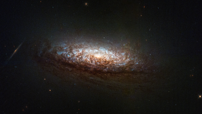 The first image taken this year with Hubble’s one-gyroscope pointing method is of NGC 1546, a nearby galaxy in the constellation Dorado. The galaxy’s orientation provides a good view of dust lanes from slightly above and backlit by the galaxy’s core. Credit: NASA, ESA, STScI, David Thilker (JHU)