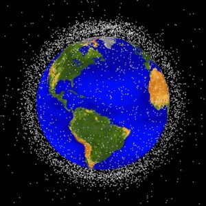 Graphic showing thousands of yellow dots around Earth. The dots represent orbital debris.