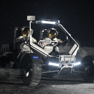 An artist’s concept design of NASA’s Lunar Terrain Vehicle. Two astronauts ride aboard this imagined version. Its lights are on. Credit: NASA