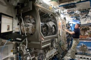NASA astronaut Kevin Ford, Expedition 34 commander, works in the Destiny laboratory of the International Space Station in 2013. Credit: NASA