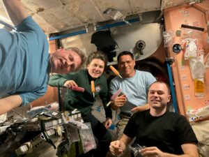 Four Expedition 68 crewmates join each other for a meal inside the International Space Station's Harmony module. From left are, Commander Sergey Prokopyev and Flight Engineer Anna Kikina, both from Roscosmos, NASA Flight Engineer Frank Rubio, and Roscosmos Flight Engineer Dmitri Petelin. Credit: NASA