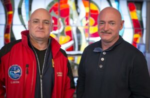 NASA Astronaut Scott Kelly, left, and his identical twin brother Mark Kelly, pose for a photograph Thursday, March 26, 2015 at the Cosmonaut Hotel in Baikonur, Kazakhstan. Credit: NASA/Bill Ingalls