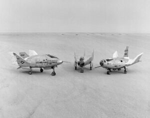 The wingless, lifting body aircraft sitting on Rogers Dry Lake at what is now NASA's Armstrong Flight Research Center. From left to right are the X-24A, M2-F3 and the HL-10. The lifting body aircraft studied the feasibility of maneuvering and landing an aerodynamic craft designed for reentry from space. Photo Credit: NASA